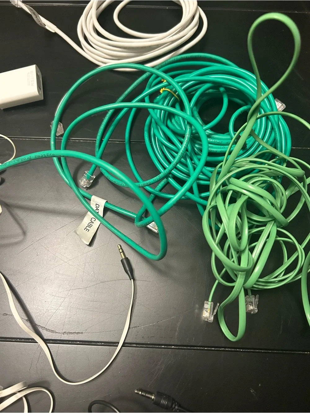 Assorted Green and White Cell Phone Accessory Cables and Adapters and more